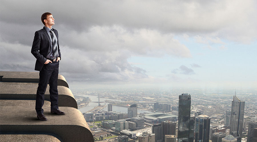 Person Standing on Top of Building